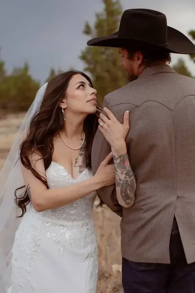 Photo of the real bride and groom posing near the stairs