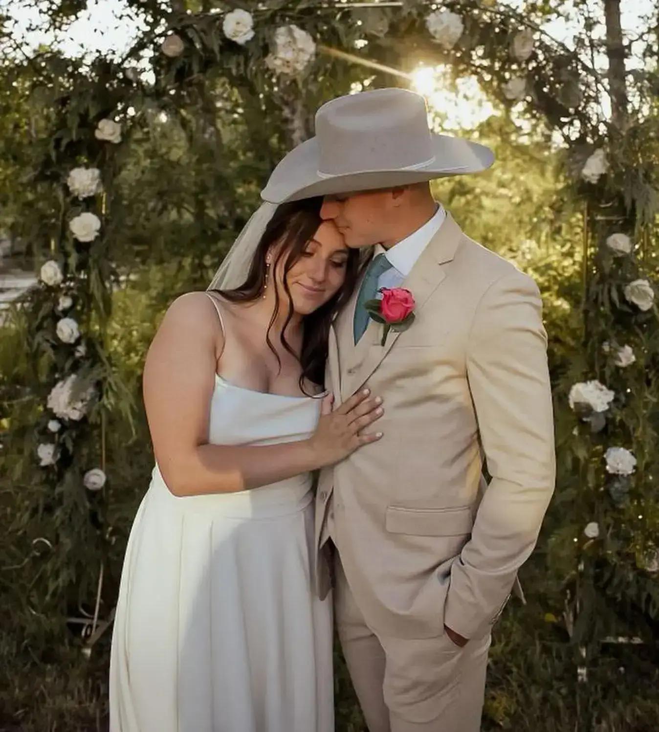 Photo of the real bride and groom in the wood